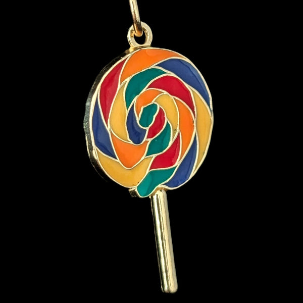 Colorful lollipop-shaped pendant on a black background