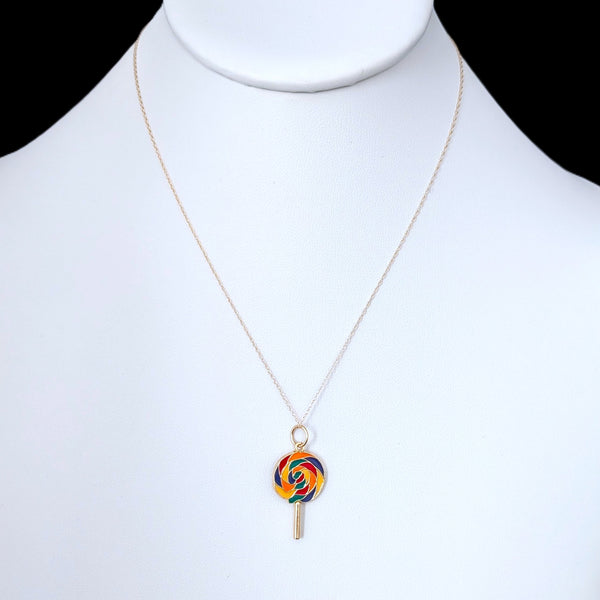 Necklace with a colorful lollipop pendant on a mannequin.