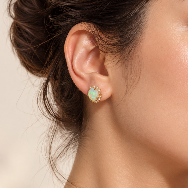 colorful opal diamond earrings on model