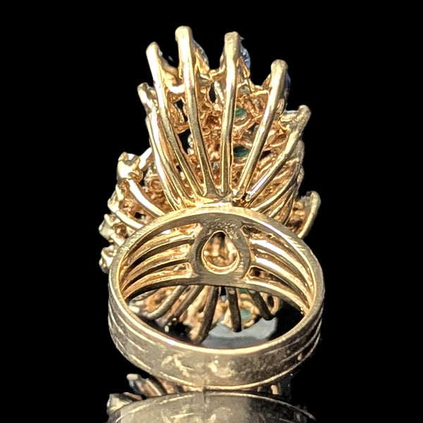 Gold ring with intricate design on a black background